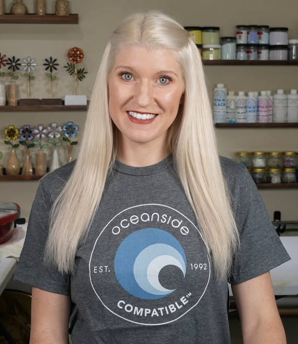 Jackie Knowles in an Oceanside Compatible shirt in a glass studio